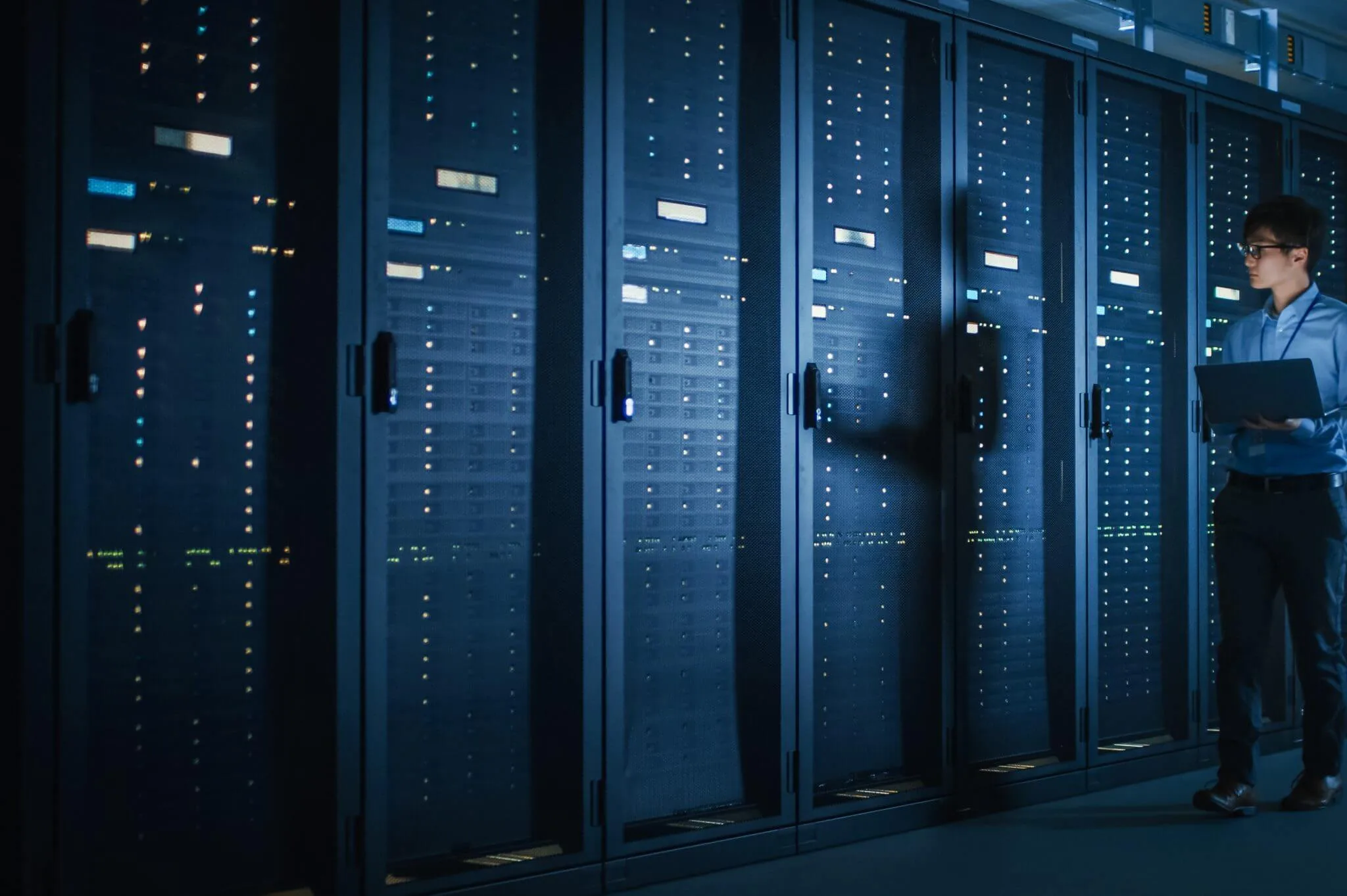 Server racks inside a data center representing website hosting reliability.