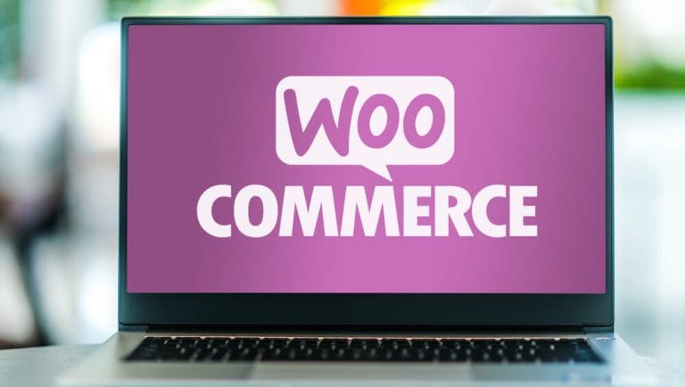 WooCommerce logo on a laptop computer.