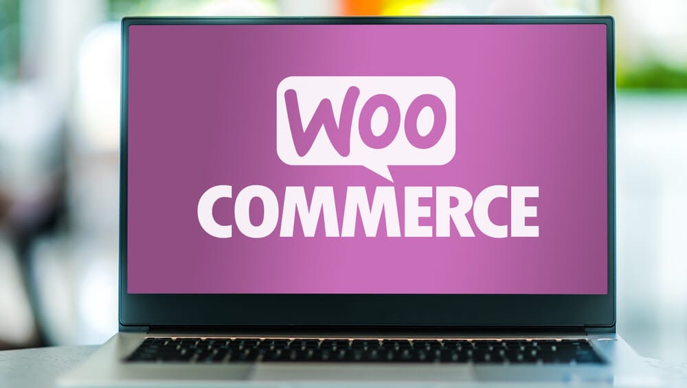 WooCommerce logo on a laptop computer.