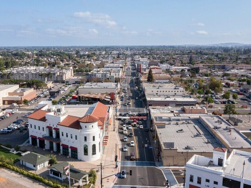 Aerial daytime view of downtown Bellflower, California, highlighting the city’s historic business district, ideal for website design Bellflower services.