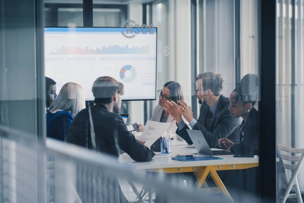 Professional services team meeting in a modern office environment